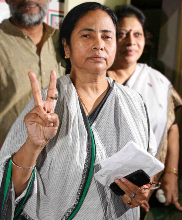 Mamata Banerjee, chief of regional Trinamool Congress shows victory sign in kolkata